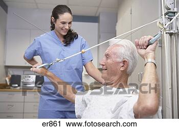 Stock Photography - senior male patient 
performing physical 
therapy with nurse. 
fotosearch - search 
stock photos, 
pictures, images, 
and photo clipart