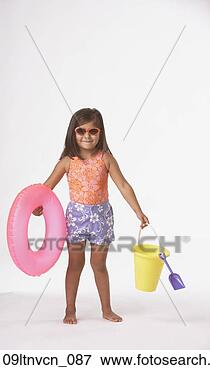 Picture - studio shot of 
hispanic girl 
with beach toys. 
fotosearch - search 
stock photos, 
pictures, images, 
and photo clipart
