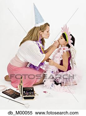 Stock Image - studio shot of 
mother and daughter 
playing dress 
up. fotosearch 
- search stock 
photos, pictures, 
images, and photo 
clipart