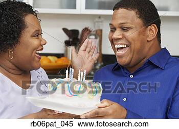 Stock Image - african couple 
celebrating birthday. 
fotosearch - search 
stock photos, 
pictures, images, 
and photo clipart