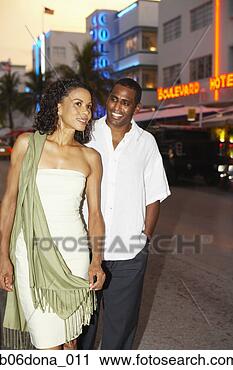 Stock Photography - african couple 
in urban night 
scene. fotosearch 
- search stock 
photos, pictures, 
images, and photo 
clipart