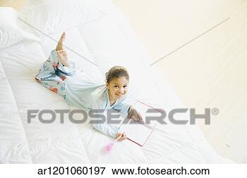 Picture - african girl writing 
in journal. fotosearch 
- search stock 
photos, pictures, 
images, and photo 
clipart