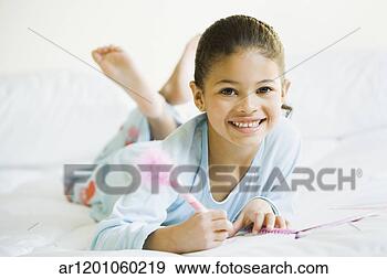 Stock Photograph - african girl writing 
in journal. fotosearch 
- search stock 
photos, pictures, 
images, and photo 
clipart