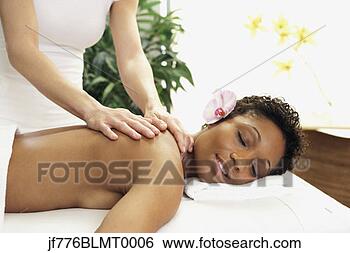 Stock Photo - african woman 
receiving massage. 
fotosearch - search 
stock photos, 
pictures, images, 
and photo clipart