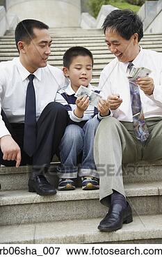 Picture - asian grandfather, 
father and son 
looking at money. 
fotosearch - search 
stock photos, 
pictures, images, 
and photo clipart