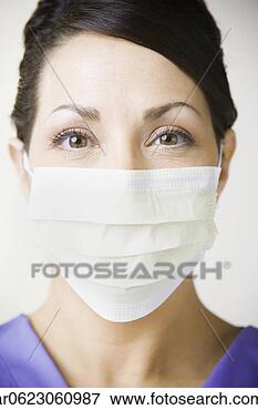 Picture - close up of hispanic 
woman wearing 
surgical mask. 
fotosearch - search 
stock photos, 
pictures, images, 
and photo clipart