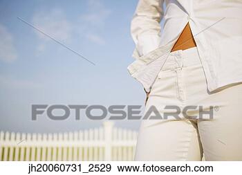 Stock Photograph - close up of woman’s 
midsection. fotosearch 
- search stock 
photos, pictures, 
images, and photo 
clipart