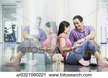 Stock Photography - hispanic couple 
sitting on floor. 
fotosearch - search 
stock photos, 
pictures, images, 
and photo clipart