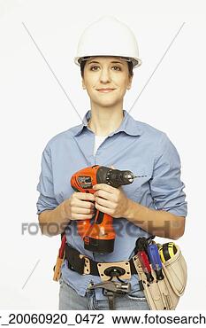 Stock Photo - hispanic female 
construction worker 
holding drill. 
fotosearch - search 
stock photos, 
pictures, images, 
and photo clipart