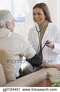 Stock Photography - hispanic female 
doctor taking 
patient’s blood 
pressure. fotosearch 
- search stock 
photos, pictures, 
images, and photo 
clipart
