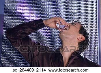 Stock Photo - hispanic man drinking 
alcohol shot. 
fotosearch - search 
stock photos, 
pictures, images, 
and photo clipart