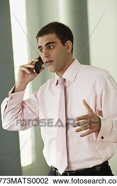 Stock Photo - middle eastern 
businessman talking 
on cell phone. 
fotosearch - search 
stock photos, 
pictures, images, 
and photo clipart