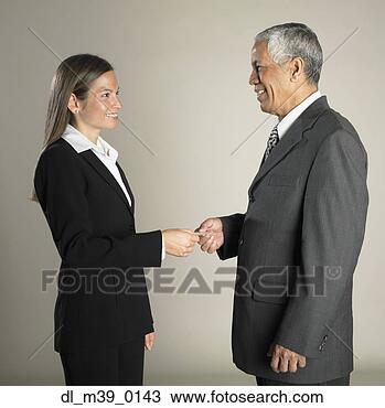 Stock Photo - multi-ethnic businesspeople 
exchanging business 
card. fotosearch 
- search stock 
photos, pictures, 
images, and photo 
clipart