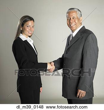 Stock Photo - multi-ethnic businesspeople 
shaking hands. 
fotosearch - search 
stock photos, 
pictures, images, 
and photo clipart