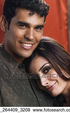 Stock Photo - portrait of multi-ethnic 
couple hugging. 
fotosearch - search 
stock photos, 
pictures, images, 
and photo clipart
