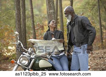 Stock Image - senior african 
bikers looking 
at map. fotosearch 
- search stock 
photos, pictures, 
images, and photo 
clipart