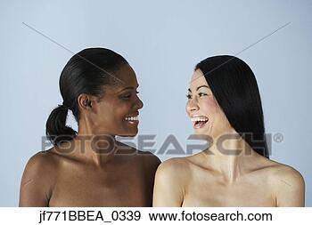 Stock Photograph - two multi-ethnic 
women smiling 
at each other. 
fotosearch - search 
stock photos, 
pictures, images, 
and photo clipart