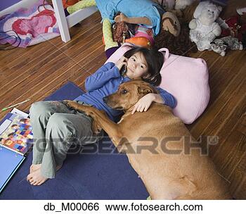 Stock Photo - asian girl with 
dog on floor. 
fotosearch - search 
stock photos, 
pictures, images, 
and photo clipart