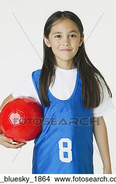 Stock Photo - asian girl holding 
soccer ball. fotosearch 
- search stock 
photos, pictures, 
images, and photo 
clipart