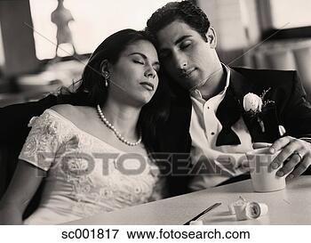 Picture - bride and groom 
with eyes closed 
at diner. fotosearch 
- search stock 
photos, pictures, 
images, and photo 
clipart