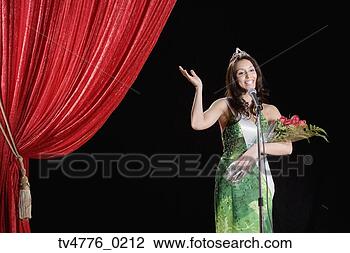 Stock Photo - hispanic beauty 
pageant winner 
waving on stage. 
fotosearch - search 
stock photos, 
pictures, images, 
and photo clipart