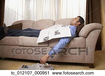 Stock Photography - hispanic man sleeping 
on sofa. fotosearch 
- search stock 
photos, pictures, 
images, and photo 
clipart