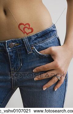 Stock Photography - hispanic woman 
with heart body 
art on stomach. 
fotosearch - search 
stock photos, 
pictures, images, 
and photo clipart