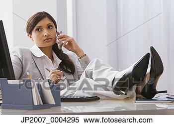 Stock Image - indian businesswoman 
with feet on desk. 
fotosearch - search 
stock photos, 
pictures, images, 
and photo clipart