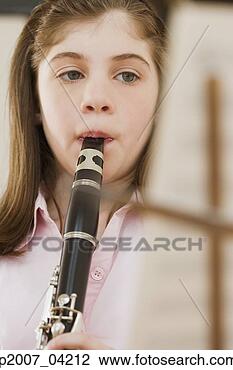 Stock Photo - irish girl playing 
clarinet. fotosearch 
- search stock 
photos, pictures, 
images, and photo 
clipart
