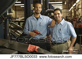 Stock Photo - multi-ethnic male 
auto mechanics 
in shop. fotosearch 
- search stock 
photos, pictures, 
images, and photo 
clipart