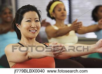 Stock Photography - multi-ethnic women 
in exercise class. 
fotosearch - search 
stock photos, 
pictures, images, 
and photo clipart