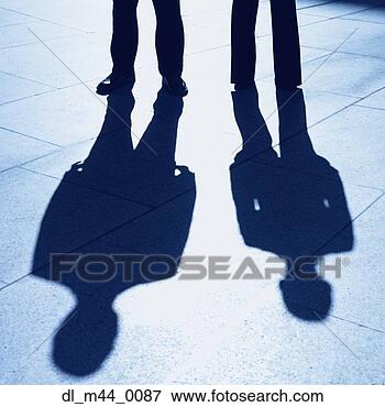 Picture - shadows of businesswoman 
and businessman. 
fotosearch - search 
stock photos, 
pictures, images, 
and photo clipart