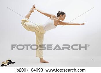 Stock Photo - woman practicing 
yoga. fotosearch 
- search stock 
photos, pictures, 
images, and photo 
clipart