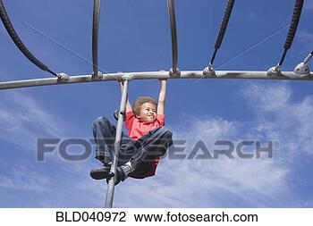 Stock Photo - african american 
boy playing on 
jungle gym. fotosearch 
- search stock 
photos, pictures, 
images, and photo 
clipart
