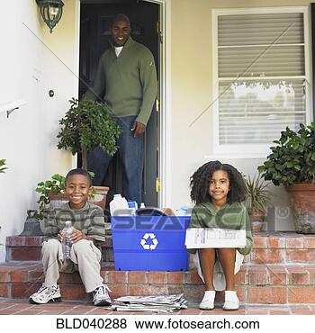 Stock Photo - african american 
father smiling 
at children with 
recycling. fotosearch 
- search stock 
photos, pictures, 
images, and photo 
clipart