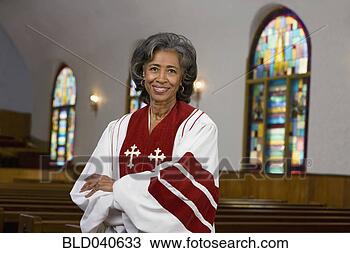 Stock Photo - african american 
female reverend 
with arms crossed. 
fotosearch - search 
stock photos, 
pictures, images, 
and photo clipart
