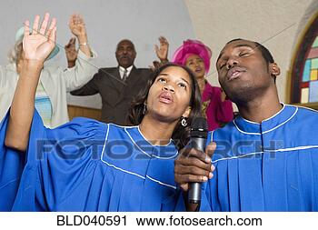 Stock Photography - african american 
people singing 
in church. fotosearch 
- search stock 
photos, pictures, 
images, and photo 
clipart