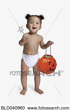 Stock Photography - african baby holding 
jack-o-lantern. 
fotosearch - search 
stock photos, 
pictures, images, 
and photo clipart