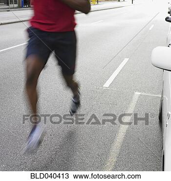 Stock Photo - african man jogging 
in city. fotosearch 
- search stock 
photos, pictures, 
images, and photo 
clipart