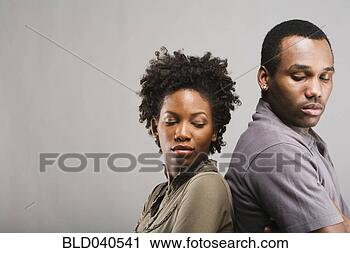 Stock Photography - angry african 
american couple 
standing back 
to back. fotosearch 
- search stock 
photos, pictures, 
images, and photo 
clipart