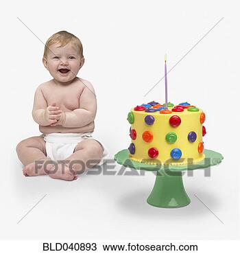 Stock Photo - baby next to birthday <br>cake. fotosearch <br>- search stock <br>photos, pictures, <br>images, and photo <br>clipart