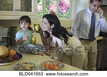 Stock Photo - family hanging 
out in kitchen 
before work. fotosearch 
- search stock 
photos, pictures, 
images, and photo 
clipart