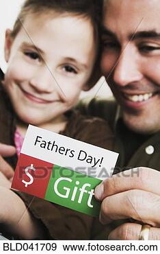 Stock Photograph - father and son 
with father’s 
day gift card. 
fotosearch - search 
stock photos, 
pictures, images, 
and photo clipart