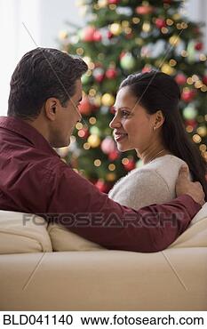 Stock Photography - hispanic couple 
smiling at each 
other. fotosearch 
- search stock 
photos, pictures, 
images, and photo 
clipart