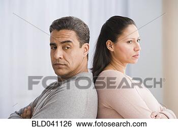Stock Photo - hispanic couple 
standing back 
to back. fotosearch 
- search stock 
photos, pictures, 
images, and photo 
clipart