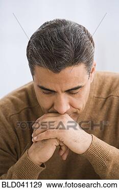 Stock Photograph - hispanic man leaning 
head on hands. 
fotosearch - search 
stock photos, 
pictures, images, 
and photo clipart