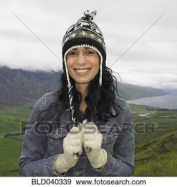 Stock Photograph - hispanic woman 
wearing hat and 
gloves. fotosearch 
- search stock 
photos, pictures, 
images, and photo 
clipart
