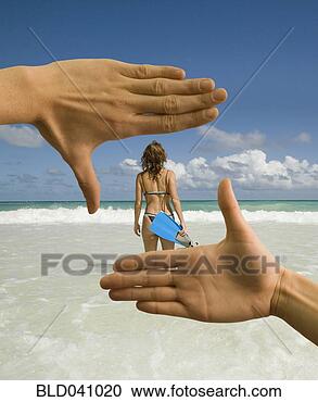 Stock Photography - man using hands 
to frame woman 
on beach. fotosearch 
- search stock 
photos, pictures, 
images, and photo 
clipart