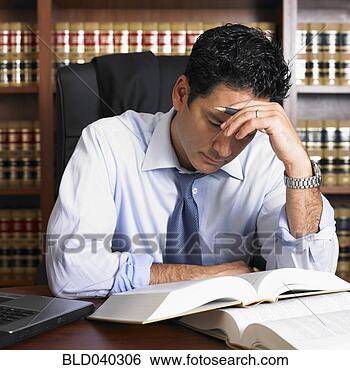 Stock Photo - mixed race male 
lawyer reading. 
fotosearch - search 
stock photos, 
pictures, images, 
and photo clipart