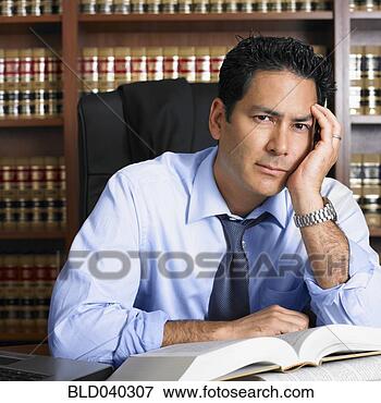 Picture - mixed race male 
lawyer with open 
book. fotosearch 
- search stock 
photos, pictures, 
images, and photo 
clipart